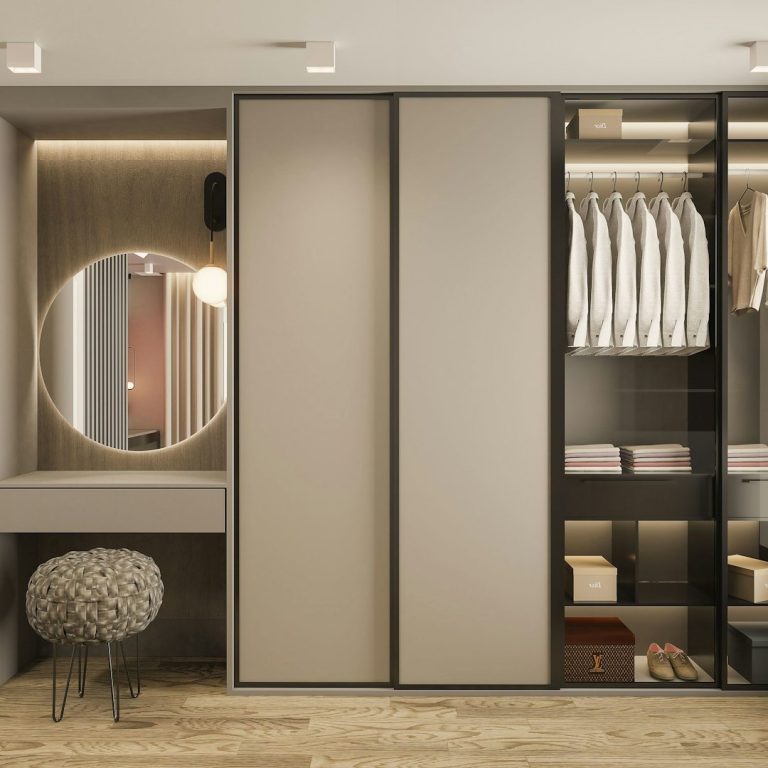 Stylish modern wardrobe with sliding doors, mirror, and organised shelves.